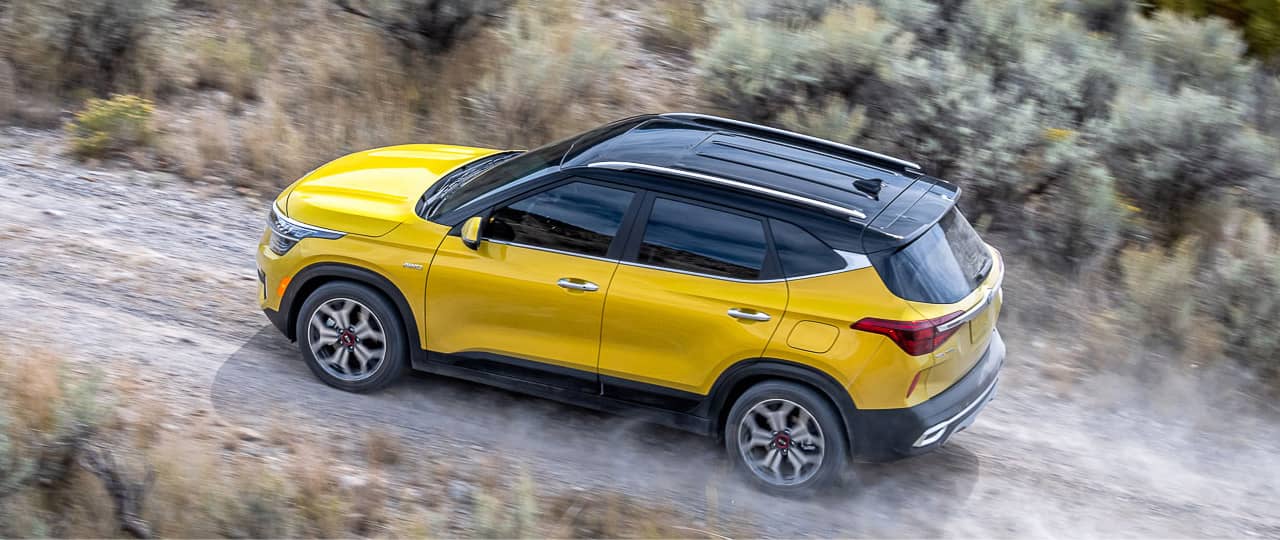Kia Seltos driving on terrain with AWD